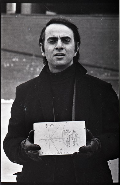 Carl Sagan holding the Pioneer plaque in City Hall Plaza, March 1972